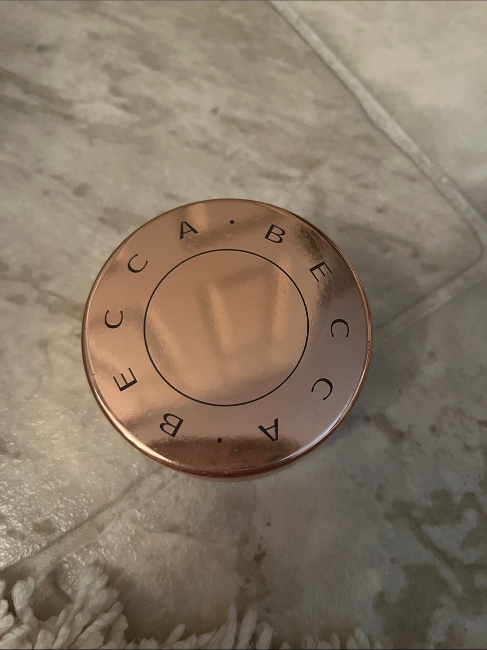 BECCA limited edition glow dust highlighter in Champagne pop loose powder